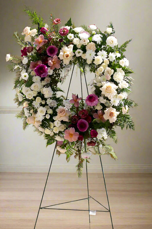 Floral wreath on a stand with a blurred background